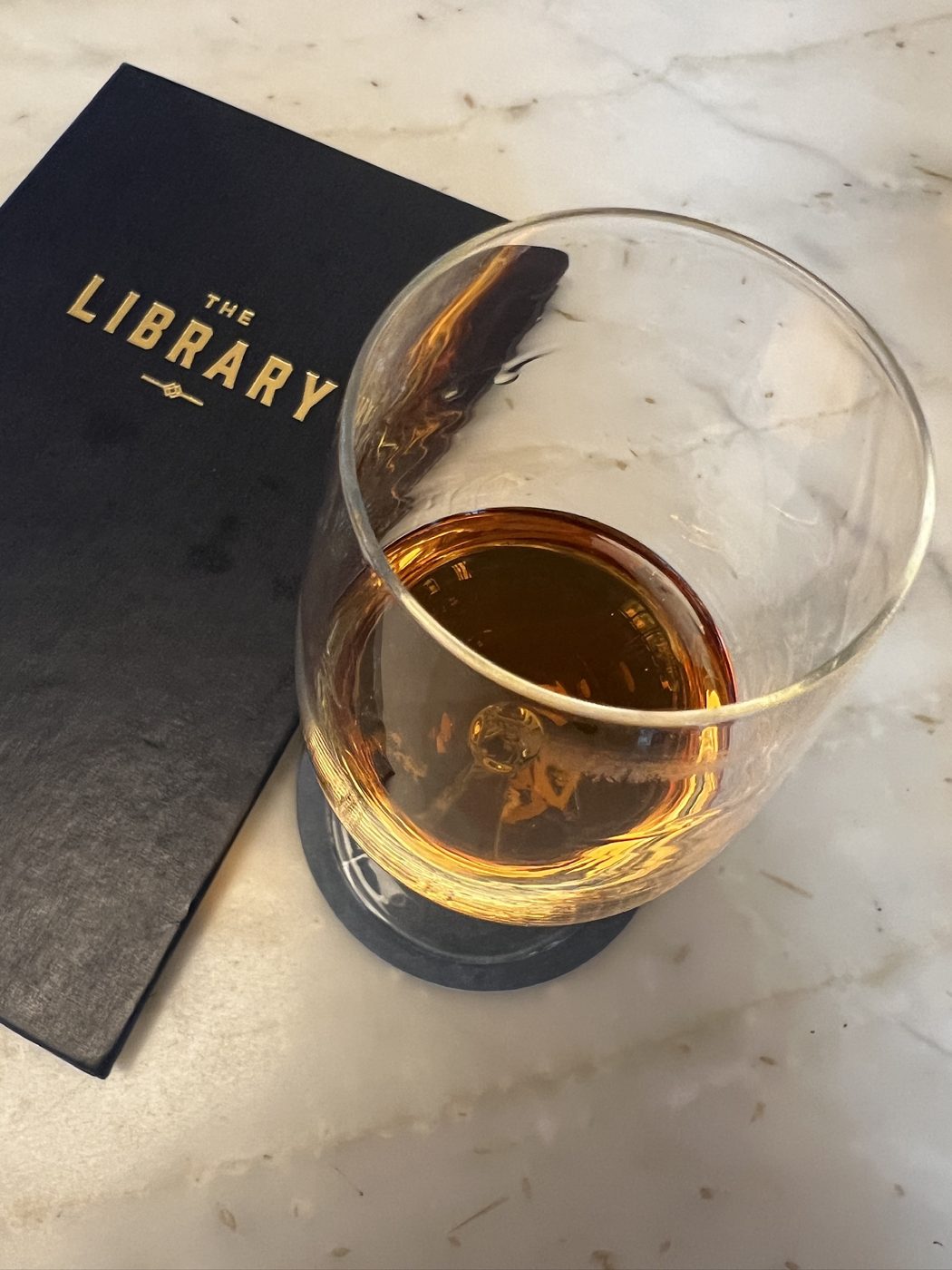 A glass of whiskey, neat, at The Library speakeasy in St. Pete, FL